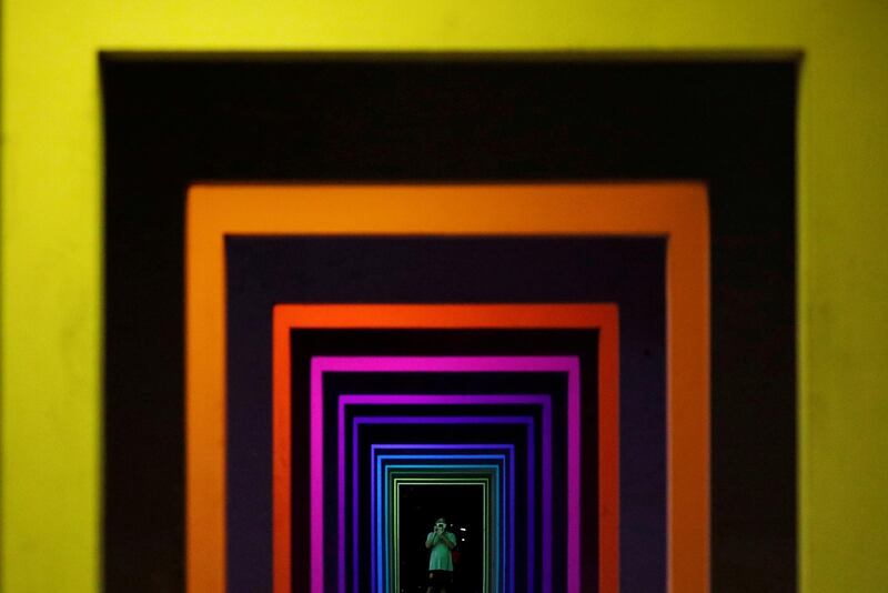 The ground floor of an apartment block in Singapore is turned into a rainbow walkway for a few hours by art group Very Small Exhibition. Reuters