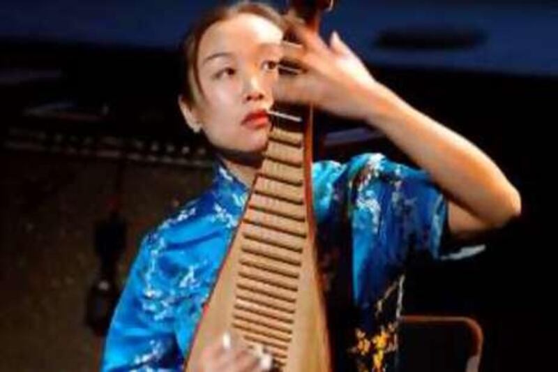 Chinese Liu Fang plays the lute, 23 November 2006 in Paris, during the Charles Cros Academy (the French equivalent of the US Recording Academy) award ceremony. Liu Fang was awarded the Grand Prix. AFP PHOTO / ERIC FEFERBERG