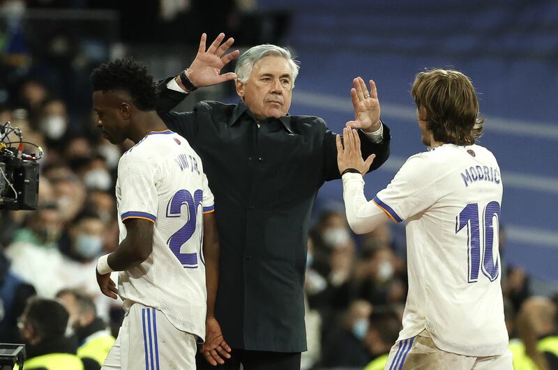 Real Madrid manager Carlo Ancelotti celebrates with Luka Modric. EPA