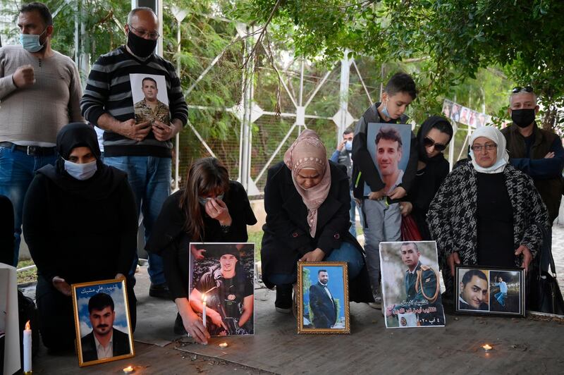 Families of the Beirut port explosion victims hold their pictures during a protest to demand a faster investigation into the causes of the explosion. At least 190 people were killed and more than 6,000 were injured on August 4, 2020, when a massive blast, believed to have been caused by an estimated 2,750 tons of ammonium nitrate stored in a warehouse, devastated the port area of Beirut and several parts of the city. EPA