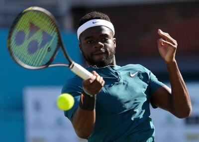 Frances Tiafoe of the USA plays a return to Jeremy Chardy of France during their quarterfinal tennis match at the Queen's Club tennis tournament in London, Friday, June 22, 2018. (AP Photo/Kirsty Wigglesworth)