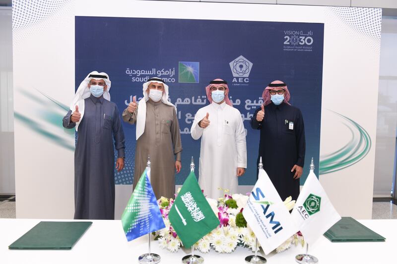 Nabil Al Nuaim, Ahmad Al Sa’adi, Walid Abu Khalid and Ziad Al Musallam at the signing ceremony involving Saudi Aramco and Advanced Electronics Company. Photo: Aramco