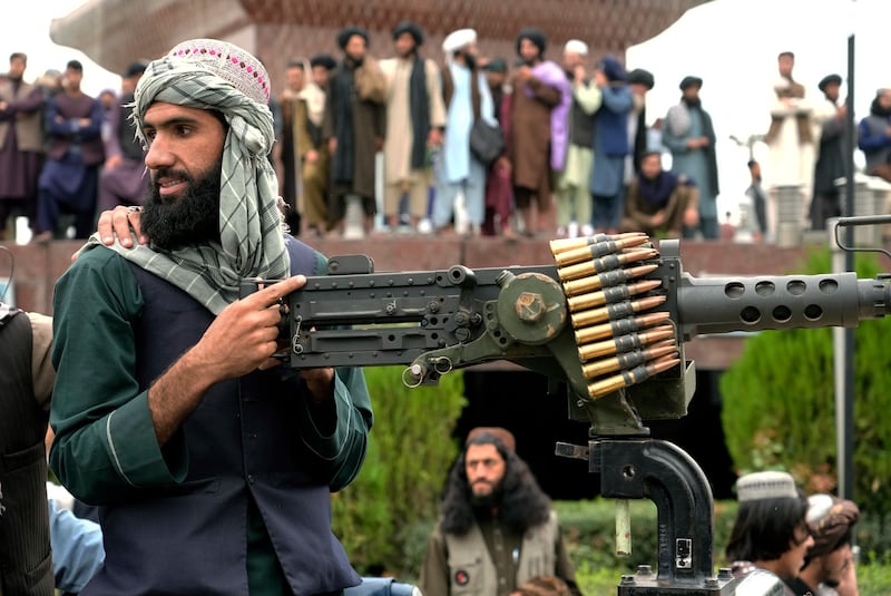 A Taliban fighter mans his weapon during the mass gathering in Kabul. AP