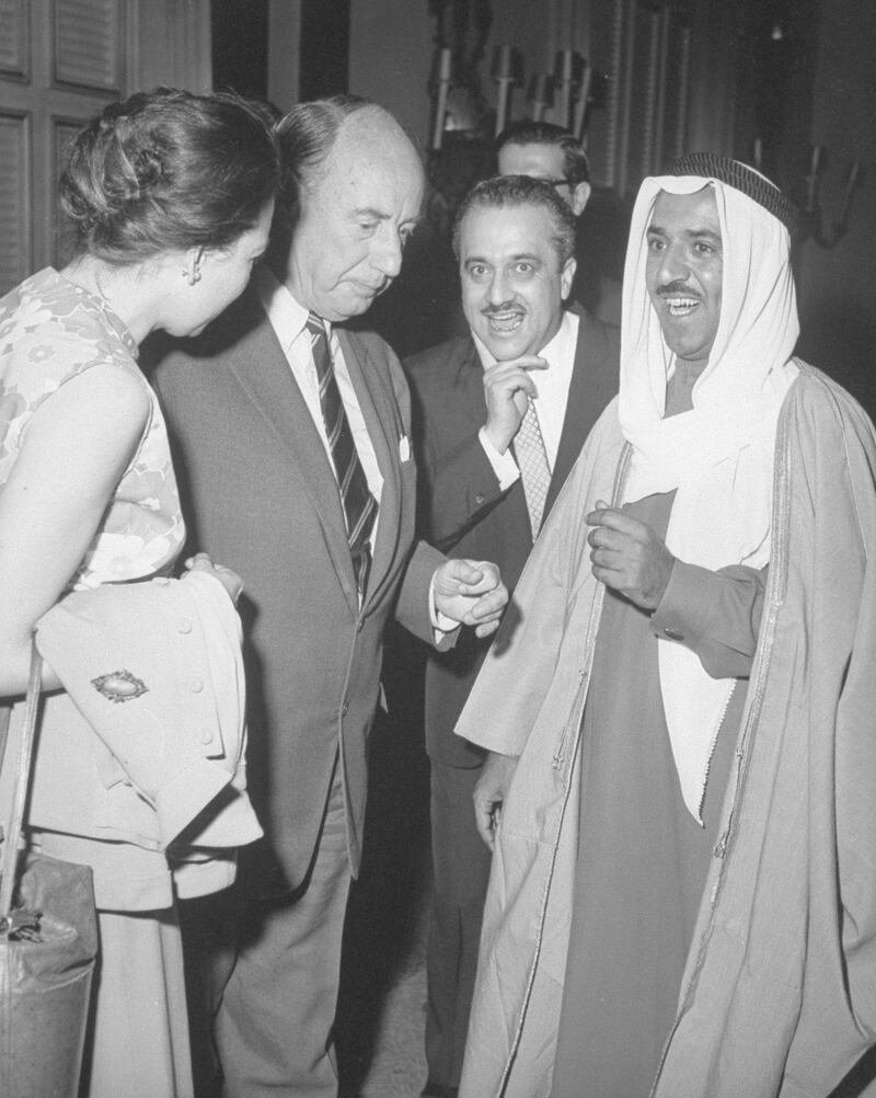 US Amb. to UN Adlai Stevenson standing beside unident. woman & w. Talat Ghoussein, Charge d'Affaires of Kuwait Embassy (2R) & Kuwaiti For. Min. Sheikh Sabah Al-Ahmad Al-Sabah, at Kuwaiti reception at UN.  (Photo by Leo Rosenthal/Pix Inc./The LIFE Images Collection via Getty Images/Getty Images)
