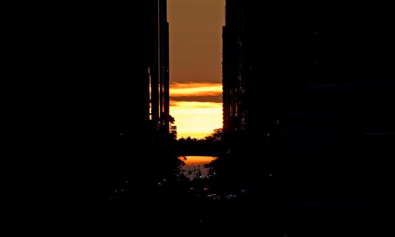 The sun sets behind 42nd Street in Manhattan during a power outage in New York City. AFP