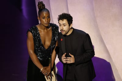 Ramy Youssef, seen here with writer and actor Issa Rae, wore an Artists for Ceasefire during the Oscars this year. EPA