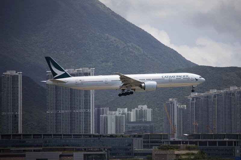 A Boeing Co. 777 aircraft operated by Cathay Pacific Airways Ltd. prepares to land at Hong Kong International Airport in Hong Kong, China, on Saturday, August 12, 2017. With the company expected to announce another loss this week, Cathay needs to shift strategy from being the region's top airline for premium fliers and make a bigger effort to woo some of the millions of mainland leisure travelers who have enriched its state-owned rivals in China, analysts say. Photographer: Vivek Prakash/Bloomberg
