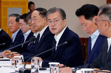 South Korean President Moon Jae-in, third from right, speaks during a meeting with business leaders at the presidential Blue House in Seoul, South Korea. AP