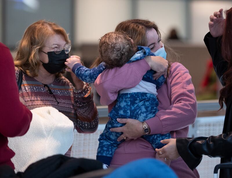 Balbina Gonzalez embraces her one-year-old granddaughter for the first time outside the US Customs and Border Protection  Logan International Airport. EPA