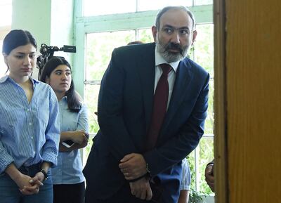 FILE PHOTO: Armenia's acting Prime Minister and leader of Civil Contract party Nikol Pashinyan visits a polling station to cast his vote during the snap parliamentary election in Yerevan, Armenia June 20, 2021. Lusi Sargsyan/Photolure via REUTERS  ATTENTION EDITORS - THIS IMAGE HAS BEEN SUPPLIED BY A THIRD PARTY./File Photo