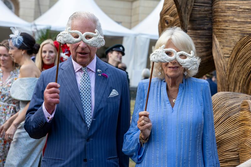 King Charles and Queen Camilla pose with masquerade masks as they attend the Animal Ball at Lancaster House in London to mark the 20th anniversary of wildlife conservation charity Elephant Family in June