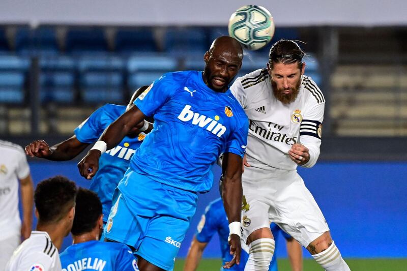 Real Madrid's Sergio Ramos vies with Valencia's Eliaquim Mangala. AFP