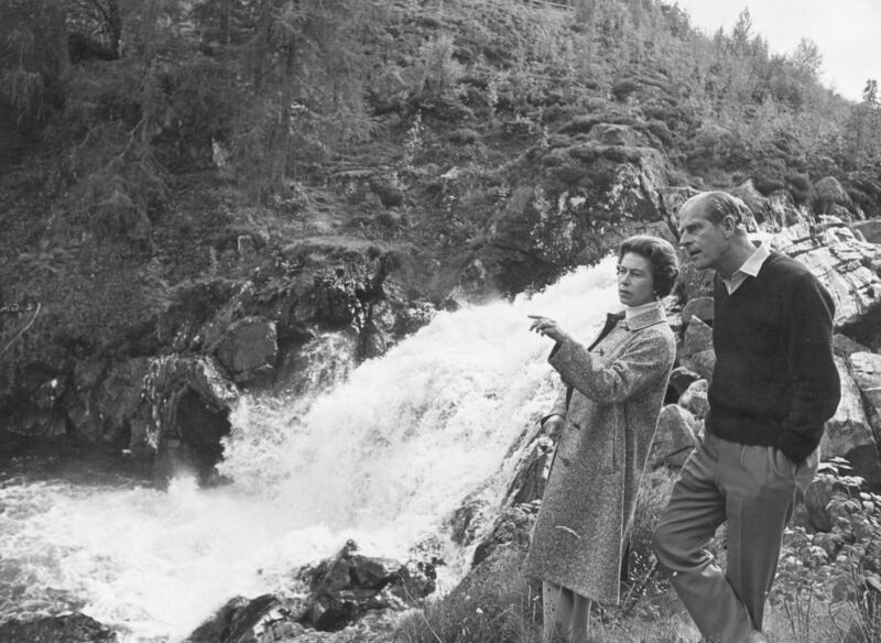 Queen Elizabeth and Prince Philip by a waterfall in the grounds of Balmoral Castle in 1972.