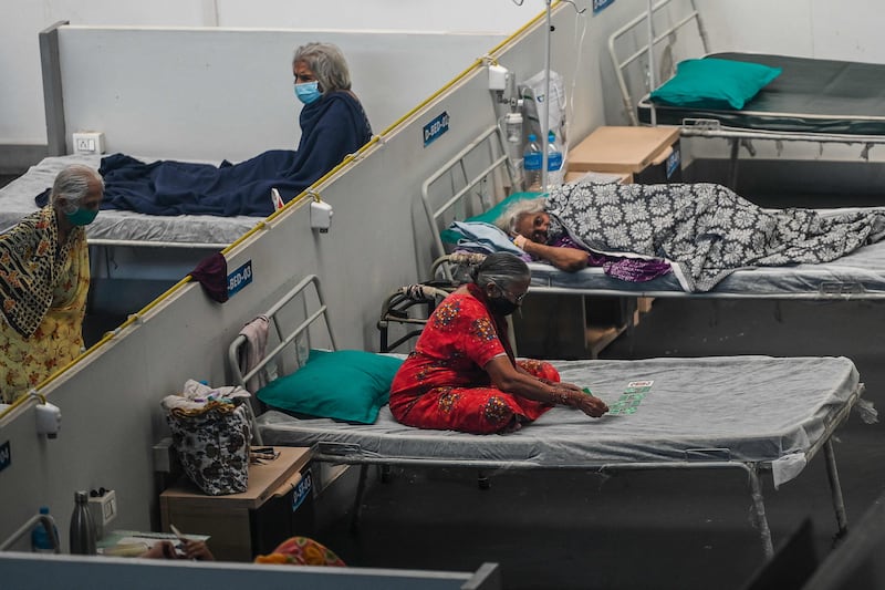 Patients rest inside a Covid-19 isolation centre in Navi Mumbai, India. AFP