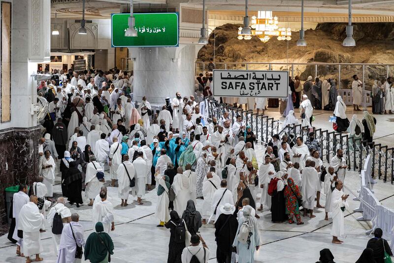 Pilgrims walk between the Marwa and Safa hills at the Grand Mosque. AFP
