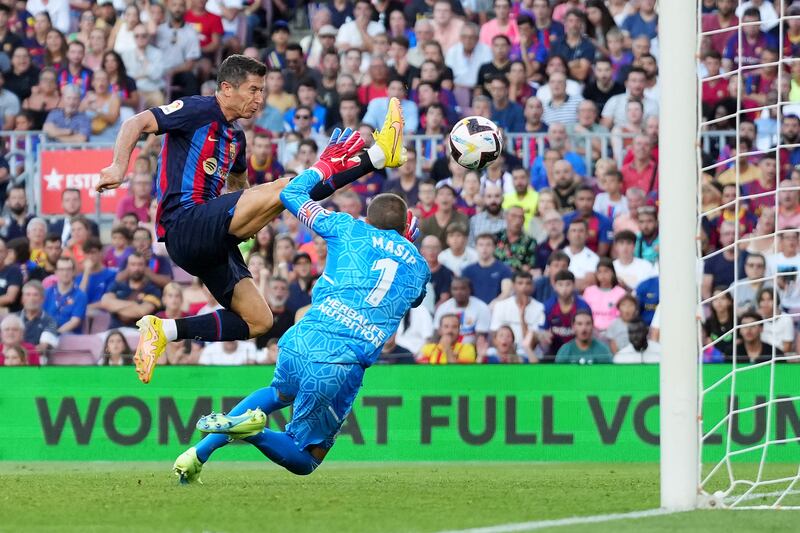 Robert Lewandowski scores Barcelona's first goal past Jordi Masip of Real Valladolid. Getty