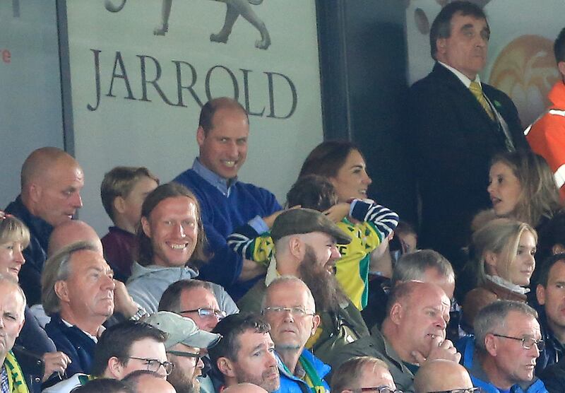 Prince George, Prince William, and Catherine, Duchess of Cambridge are seen in the stands. Getty Images