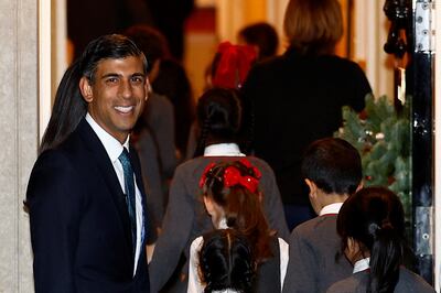 British Prime Minister Rishi Sunak looks on, during the switching on the Christmas tree lights ceremony. On Tuesday he will host a viewing of the England v Wales football match in Downing Street. Reuters