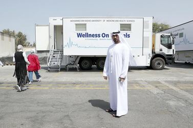 Salah Al Bahri from Dubai Health Authority at the MBRU supported community mobile health clinic near the Al Waha Community on Nad Al Hamar Road in Dubai. Pawan Singh / The National