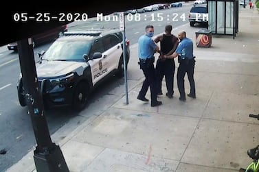 This image from video shows Minneapolis police Officers Thomas Lane, left and J. Alexander Kueng, right, escorting George Floyd, centre, to a police vehicle in Minneapolis, on May 25, 2020. Court TV via AP