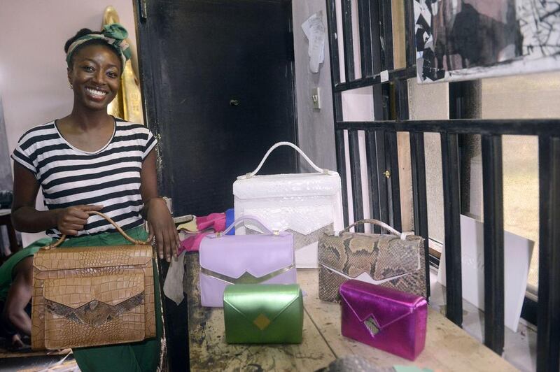 Handbag designer Zainab Ashadu poses with her creations at her Lagos workshop. Pius Utomi Ekpei / AFP photo