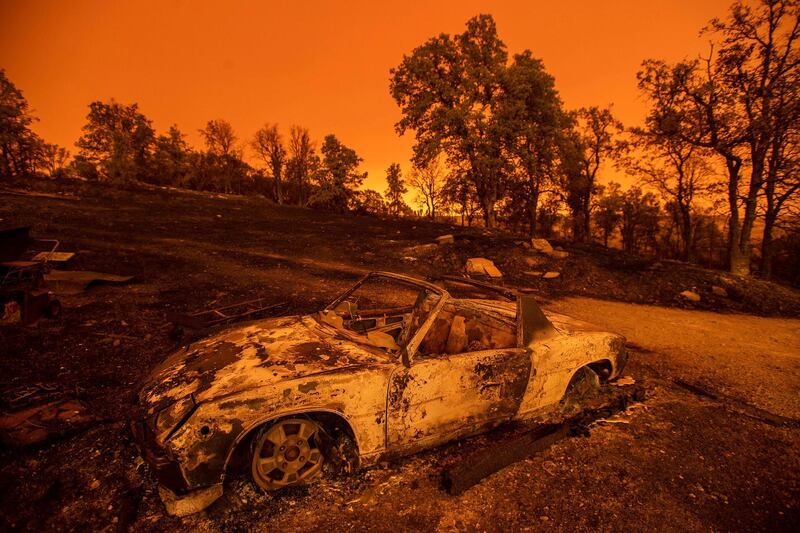Cars scorched by the Carr Fire rest at a residence in Redding, California. Noah Berger/AP Photo