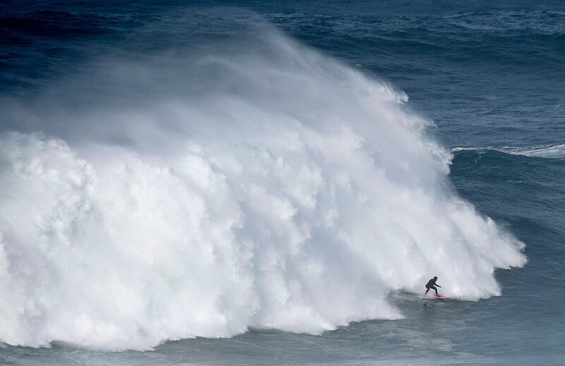 Brazilian big wave surfer Maya Gabeira drops a wave during a surf session at Praia do Norte in Nazare. Francisco Leong / AFP Photo