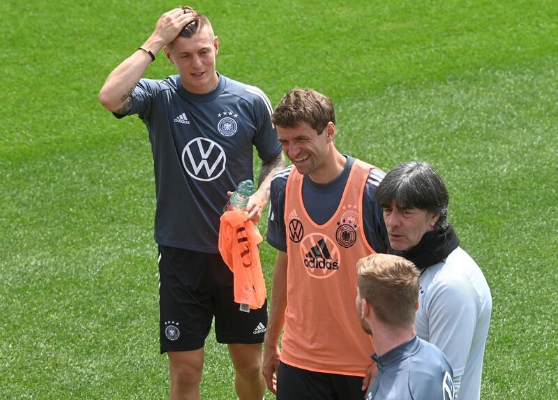 Midfielder Toni Kroos, forward Thomas Muller, coach Joachim Low and forward Timo Werner. AFP