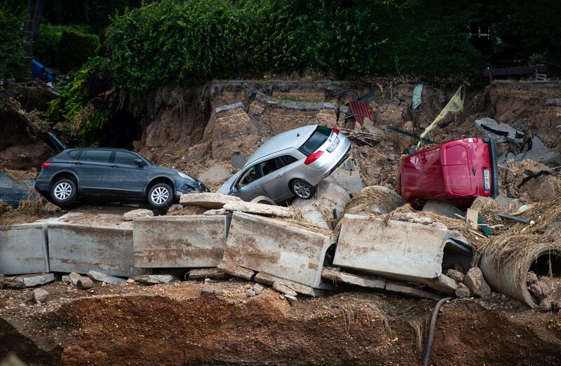 Cars swept away by flooding lie washed up at Erftstadt-Blessem, North Rhine-Westphalia.