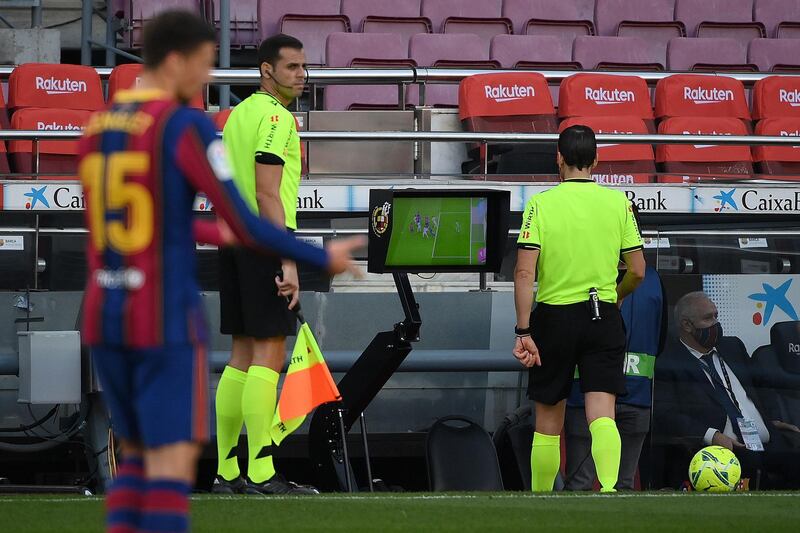 Spanish referee Juan Martinez Munuera reviews the VAR before awarding Real Madrid a penalty. AFP
