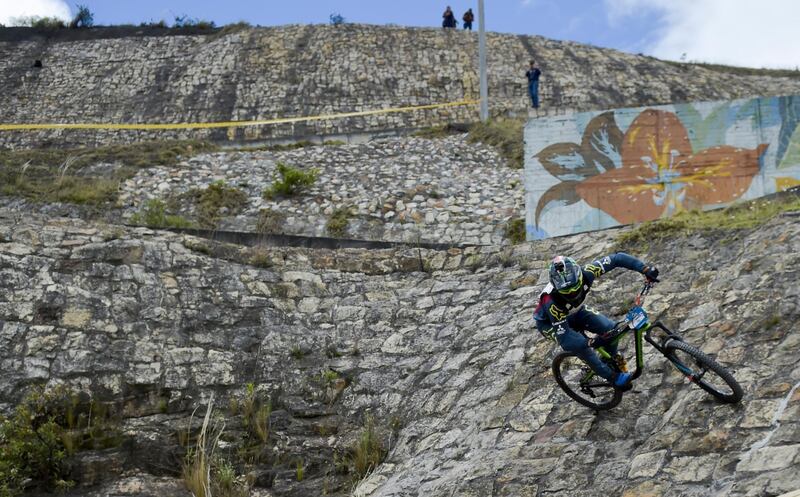 A competitor takes part in the Downhill Urbano event at Ciudad Bolivar, in southern Bogota, on Saturday, October 12.  AFP