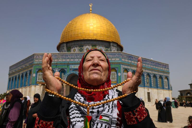A Palestinian Muslim devotee arrives at the compound of Al Aqsa Mosque in Jerusalem for the third Friday noon prayer of this year's Ramadan. AFP