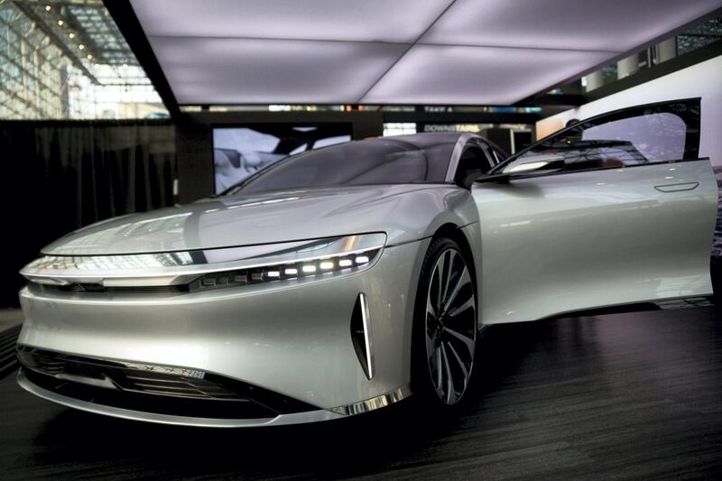 A Lucid Motors Inc. branded Air vehicle sits on display during the 2017 New York International Auto Show (NYIAS) in New York, U.S., on Wednesday, April 12, 2017. The New York International Auto Show, North America's first and largest-attended auto show dating back to 1900, showcases an incredible collection of cutting-edge design and extraordinary innovation. Photographer: Andrew Harrer/Bloomberg