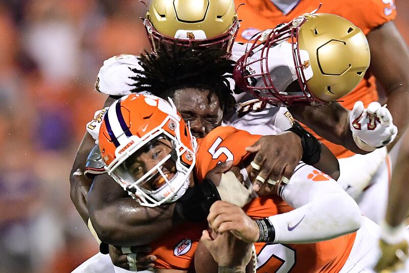 Clemson Tigers quarterback DJ Uiagalelei is tackled by Boston College Eagles' Cam Horsley during the NCAA match  at Memorial Stadium in South Carolina on Saturday, October 2. Reuters