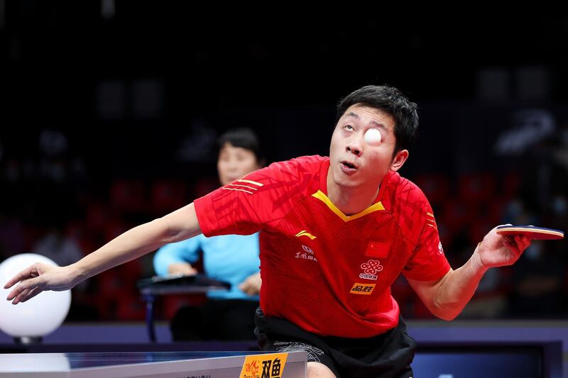 China's  Xu Xin in action against Quadri Aruna of Nigeria in their Round of 16 match at the ITTF Finals at Zhengzhou Olympic Sports Centre on Thursday, November 19. Getty