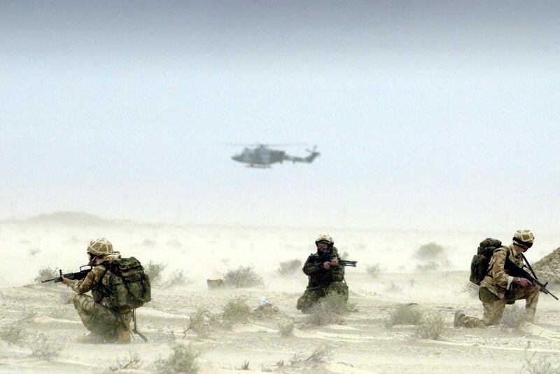 Members of Britain's 16 Air Assault Brigade on patrol during a sandstorm in the deserts around the oil fields of Rumaila in southern Iraq on March 25, 2003. AFP