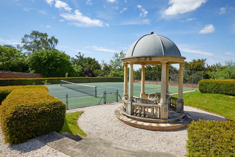 Outside, there are tennis courts, a football pitch and horse riding paddocks