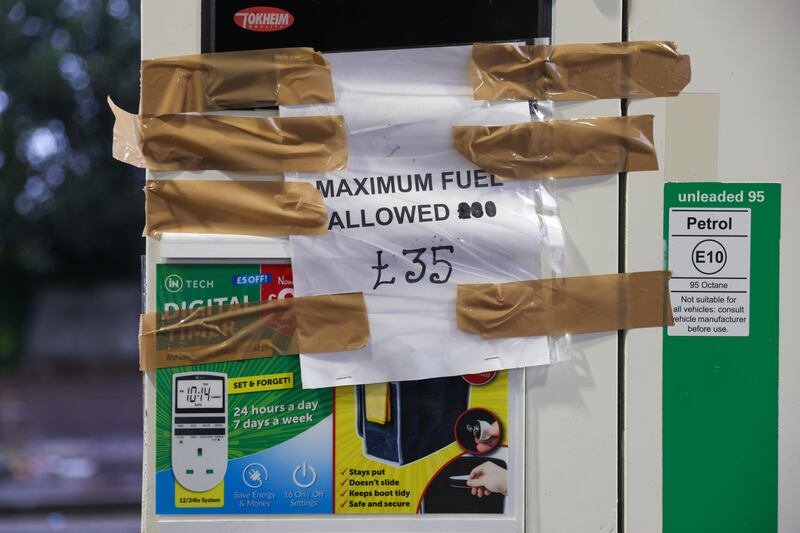 A sign displayed at a petrol station in Brighton, England. Photo: Bloomberg