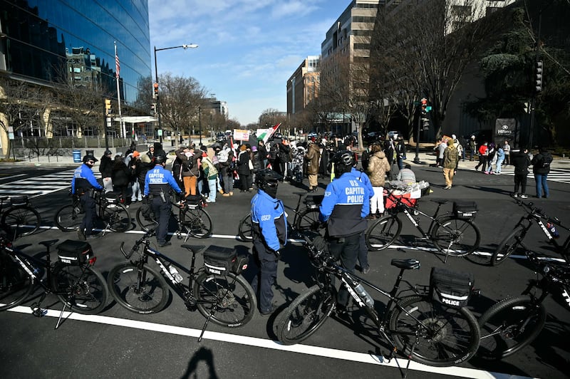 Metropolitan Police Department officers as members of the anti-Zionist Jews group Neturei Karta join pro-Palestinians people blocking a street close to the US Capitol in Washington DC. AFP