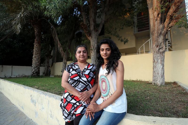Dubai, United Arab Emirates - June 18, 2019: The amnesty visa scheme has worked for a family who lived in the UAE for years without legal visas and Emirates identity cards. Anita Bhatia (L), a single-mum, got a six-month amnesty job seekers visa last year that expired this month and has got a job so her two children can get their paperwork done to legally stay in the country. Anitha has lived in the UAE since 2004 without a visa, her 20-year-old daughter Gunjan Odedra and 13-year-old son (not in pic) will get Emirates id cards for the first time. Tuesday the 18th of June 2019. Holy Trinity Church, Dubai. Chris Whiteoak / The National