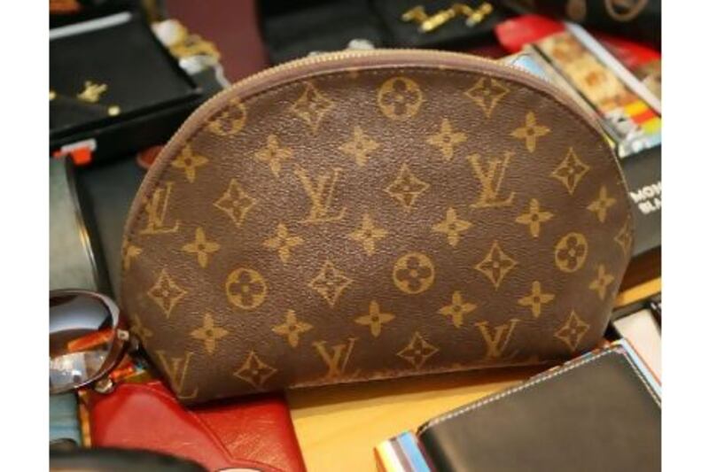 Fake luxury brands, like this Louis Vutton bag confiscated from a shop in Dubai, might fetch top dollar but they are sorry stand-ins for lesser-known brands of quality, writes one reader. (Paulo Vecina / The National)