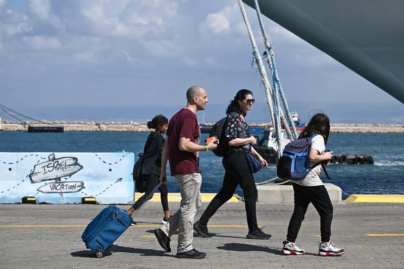 US citizens board a ship at the port of Haifa in Israel to be taken to Cyprus on October 16. AFP