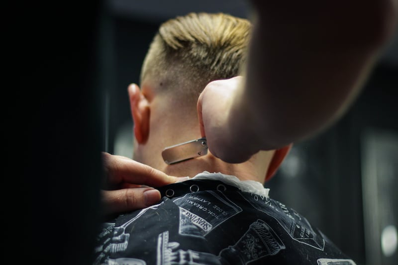 Barbershops are frequently becoming a non-judgmental space for men to talk about their personal lives. Photo: Chris Knight / Unsplash