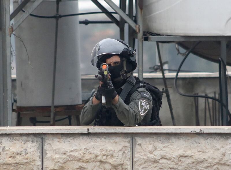 A Israeli soldier in Beit Ummar. Israeli forces shot dead three Palestinians in the occupied West Bank on November 29, Palestinian officials say. AFP