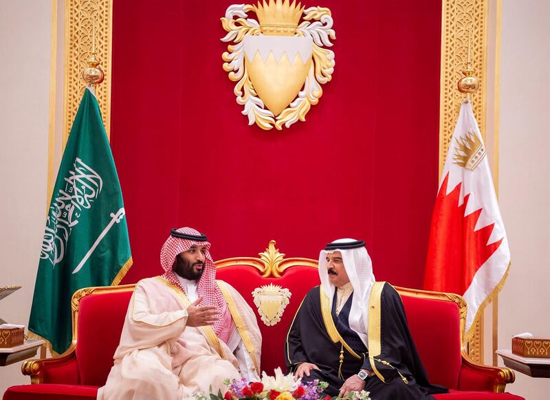 A handout photo made available by the Saudi Royal Court shows Saudi Crown Prince Mohammad Bin Salman (L) with the King of Bahrain Hamad bin Isa Al Khalifa (R), upon his arrival in Manama, Bahrain. EPA