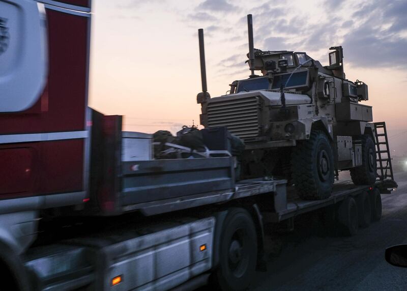 A convoy of U.S. armored military vehicles leave Syria on a road to Iraq. Getty Images