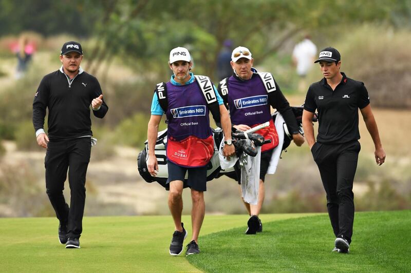 Eddie Pepperell of England, left, and Viktor Hovland of Norway walk on the 14th fairway. Getty Images