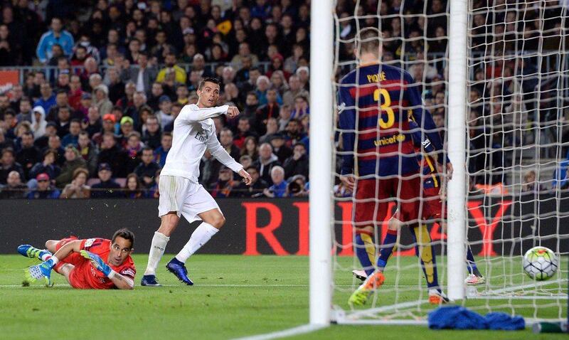 Cristiano Ronaldo wheels away after scoring the winning goal for Real Madrid against Barcelona/ Josep Lago / AFP

