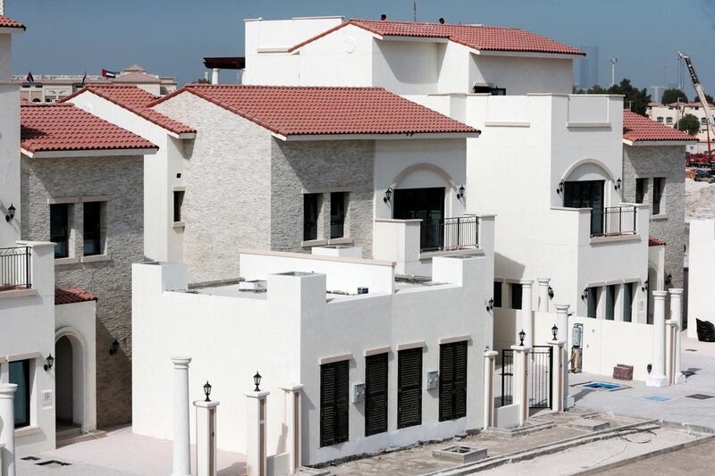 It already comprises 123 villas and town houses, all with identical pink tiled roofs. The second phase adds 55 villas. Christopher Pike / The National