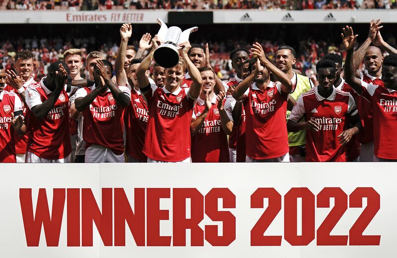 Arsenal captain Martin Odegaard lifts the trophy. PA